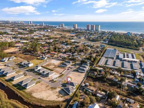 an aerial view of a city with houses and the ocean at Emerald-Gem-Inn • Laguna Haven/Beach Home! in Panama City Beach
