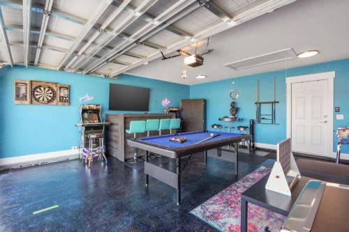a room with a ping pong table in a room at Emerald-Gem-Inn • Laguna Haven/Beach Home! in Panama City Beach