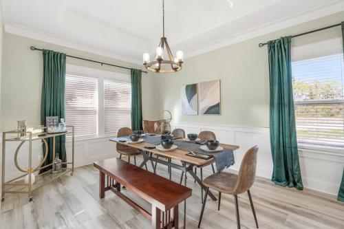 a dining room with a table and chairs at Emerald-Gem-Inn • Laguna Haven/Beach Home! in Panama City Beach