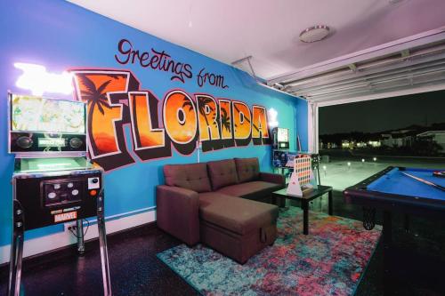 a living room with a pool table and a couch at Emerald-Gem-Inn • Laguna Haven/Beach Home! in Panama City Beach