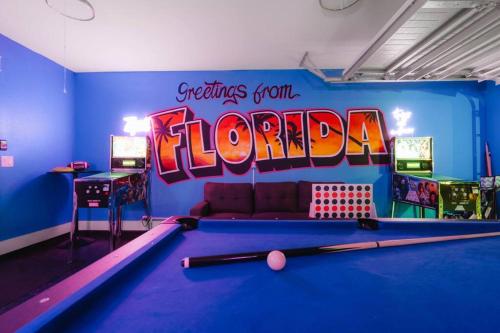 a billiard room with a pool table and a sign at Emerald-Gem-Inn • Laguna Haven/Beach Home! in Panama City Beach
