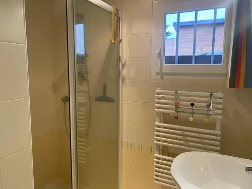 a bathroom with a shower and a sink at Maison Trégastel, 4 pièces, 5 personnes - FR-1-368-137 in Trégastel