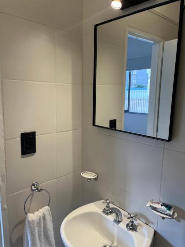 a bathroom with a sink and a mirror at Súper Precio hasta 3 Pax frente al Polo in Buenos Aires