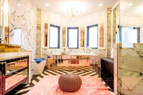 a bathroom with a shower and a sink and a table at Exquisite Pool Villa K - Pattaya 6BD Pool Villa in Pattaya South