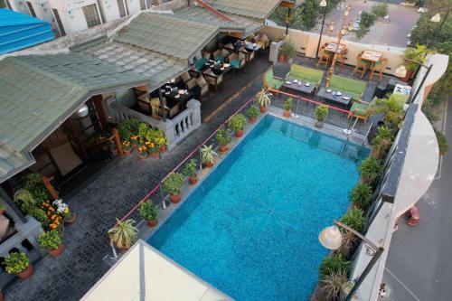 an overhead view of a swimming pool in a hotel at Best Western Merrion in Amritsar