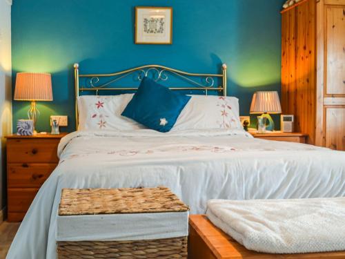 Säng eller sängar i ett rum på Queensland Cottage