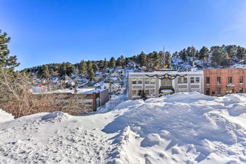 a pile of snow in front of a building at Walkable Lead Condo 5 Mi to Terry Peak Ski Area! in Lead