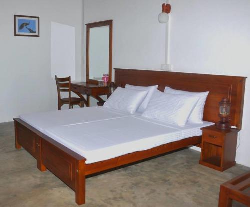 Postel nebo postele na pokoji v ubytování Pearl Oceanic Resort - Trincomalee