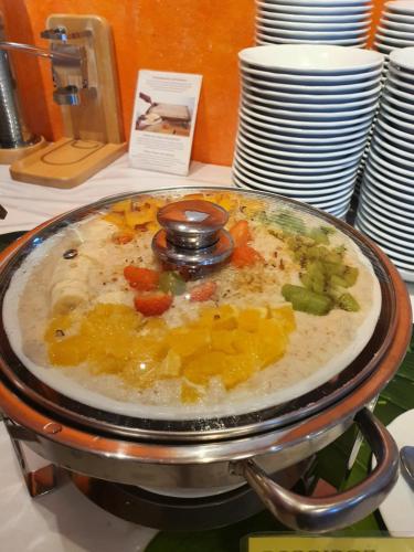 a pot of food sitting on a table at Hotel Merano in Brenzone sul Garda