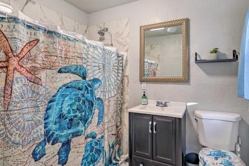 a bathroom with a turtle shower curtain and a sink at Pet-Friendly Clearfield Home Near Hill AFB! in Clearfield