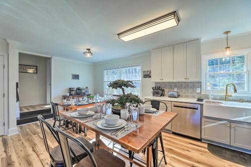 a kitchen with a wooden table and chairs in it at Family-Friendly New Bern Home with Backyard! in New Bern