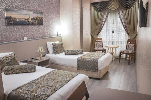En eller flere senge i et værelse på Elite Marmara Gungoren