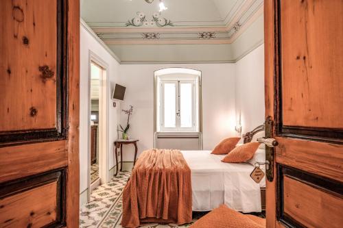 Cama o camas de una habitación en Palazzo Stunis - Dimora di Charme