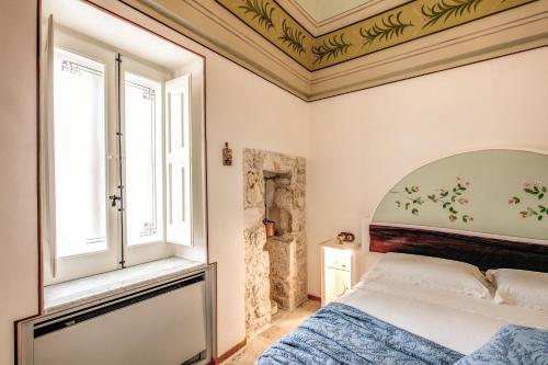 Cama o camas de una habitación en Palazzo Stunis - Dimora di Charme