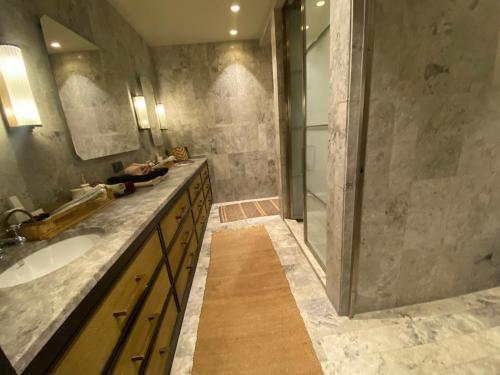a bathroom with a sink and a shower at Root Redrock Yalıkavak in Yalıkavak