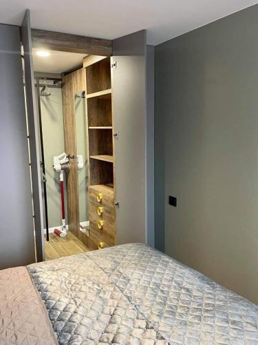 a bedroom with a bed and a walk in shower at Siauliai ‘Four sisters’ in Šiauliai