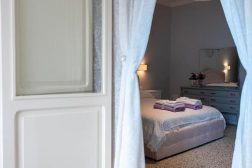 a bedroom with a bed and a dresser and a window at B & B L'ABBRACCIO in Agnone