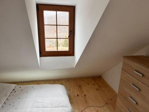 a bedroom with a bed and a window at Villa Luce in Kolašin