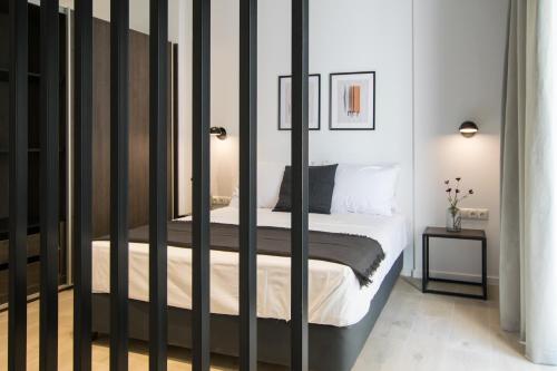 a bedroom with a bed with black rails at Voda Luxury Residence #202 in Athens