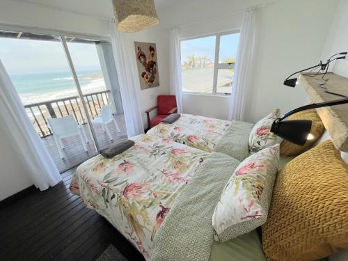 Postel nebo postele na pokoji v ubytování Mazeppa Sunrise Beach Accommodation
