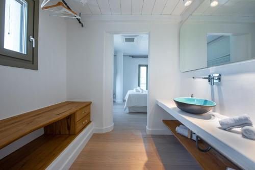 a bathroom with a sink and a bowl on a counter at Stargaze Villas in Panormos Skopelos