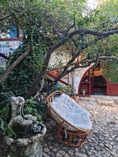 a bed in a garden with a tree at וילה תהילה המחודש - The new Villa Tehila in Rosh Pinna