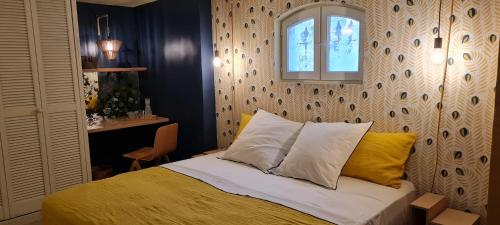 Postel nebo postele na pokoji v ubytování Villa Aigarden maison d'hôtes