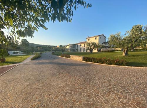 a cobblestone street with houses in the background at Agriturismo Ortaglia Bardolino in Bardolino