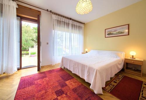 Postel nebo postele na pokoji v ubytování Apartment Ljerka