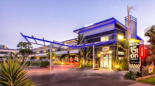 a building with a neon sign in front of it at 151 On London Motel & Conference Centre in Whanganui