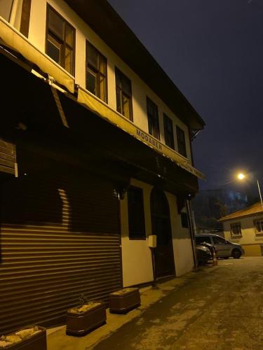 a building with a sign on the side of it at Lena Central Flats in Bursa