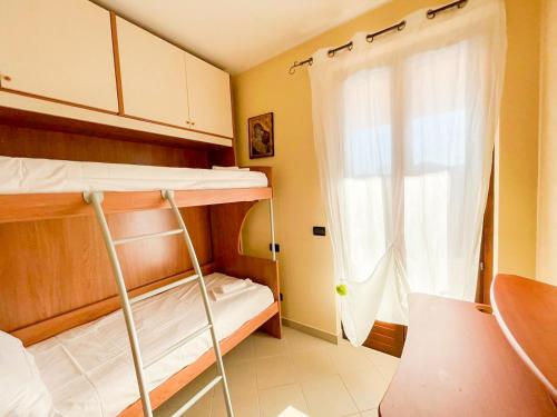 En eller flere senge i et værelse på Homiday - Villa Angelica