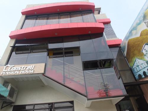 a building with a sign on the side of it at Constrell Pension House in Tagbilaran City