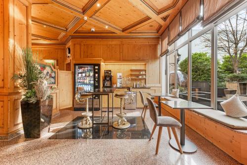 a kitchen with wooden walls and a ceiling with windows at King's Hotel Center Superior in Munich