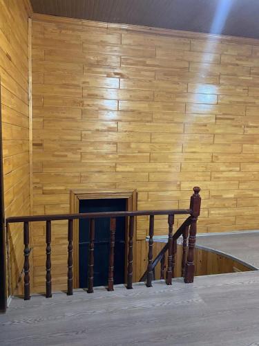 a staircase in a building with a wooden wall at Lena Central Flats in Bursa