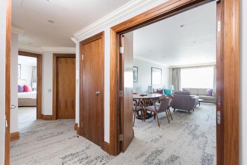 a room with a table and a dining room at Sanctum Maida Vale in London