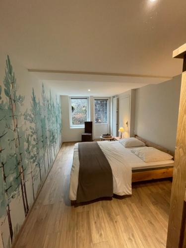 Posteľ alebo postele v izbe v ubytovaní LE LOFT et le T2, Le Mont Dore, au pied de La Dordogne