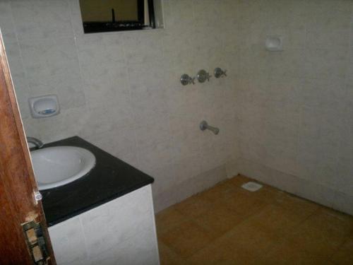 a bathroom with a sink and a mirror at Glory Holiday Resort in Mombasa