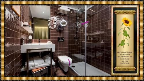 a bathroom with a shower and a toilet and a sink at Hotel Jaguar Oporto - Airport to Hotel and City Center and Vice-Versa is a Free and Continuous Shuttle Service from 7AM to 8PM in Porto