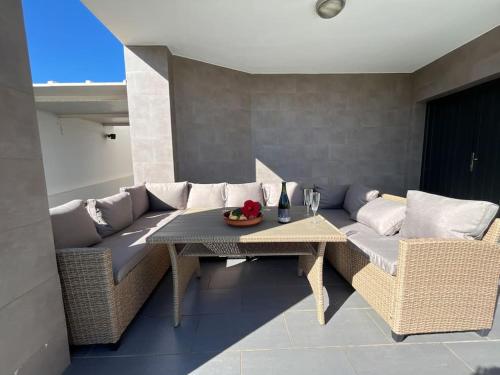 a living room with a couch and a table at Villa Maritim in Torrox