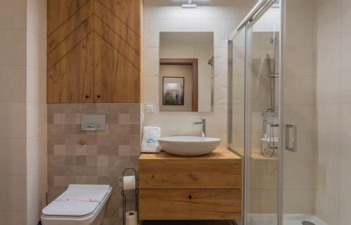 Kúpeľňa v ubytovaní Green Park Resort B19- z dostępem do basenu, sauny, jacuzzi, siłowni