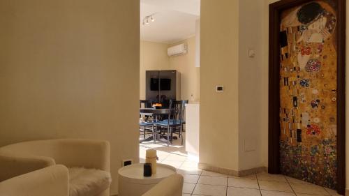 a hallway with a living room and a kitchen at Remolo Home by LoveSud in Alatri