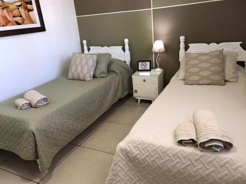 Ένα ή περισσότερα κρεβάτια σε δωμάτιο στο Casona Iguazú