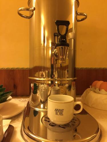 a coffee maker and a cup on a tray at Savant Hotel in Lamezia Terme