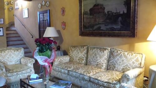 a living room with a couch and a table at Hotel Torre di San Martino in Gazzola Di Rivalta