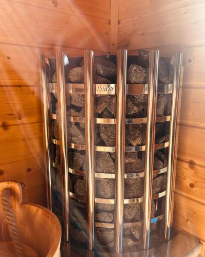 a container filled with rocks in a wall at Private Spa Lodge Odenwald in Lindenfels