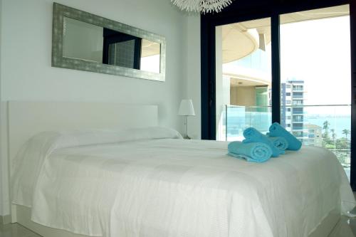 Posteľ alebo postele v izbe v ubytovaní SEA SENSES - Punta Prima - VISTA AL MAR
