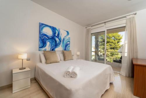 En eller flere senge i et værelse på Magnífica villa en de playa de Muro