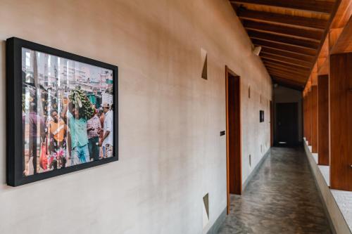 a large picture on the wall of a hallway at Villa Thamburu, Bentota in Bentota
