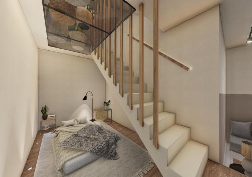 a bedroom with a bed under a staircase at Villa Alliopi ein Blick für die Sinne in Kranidi